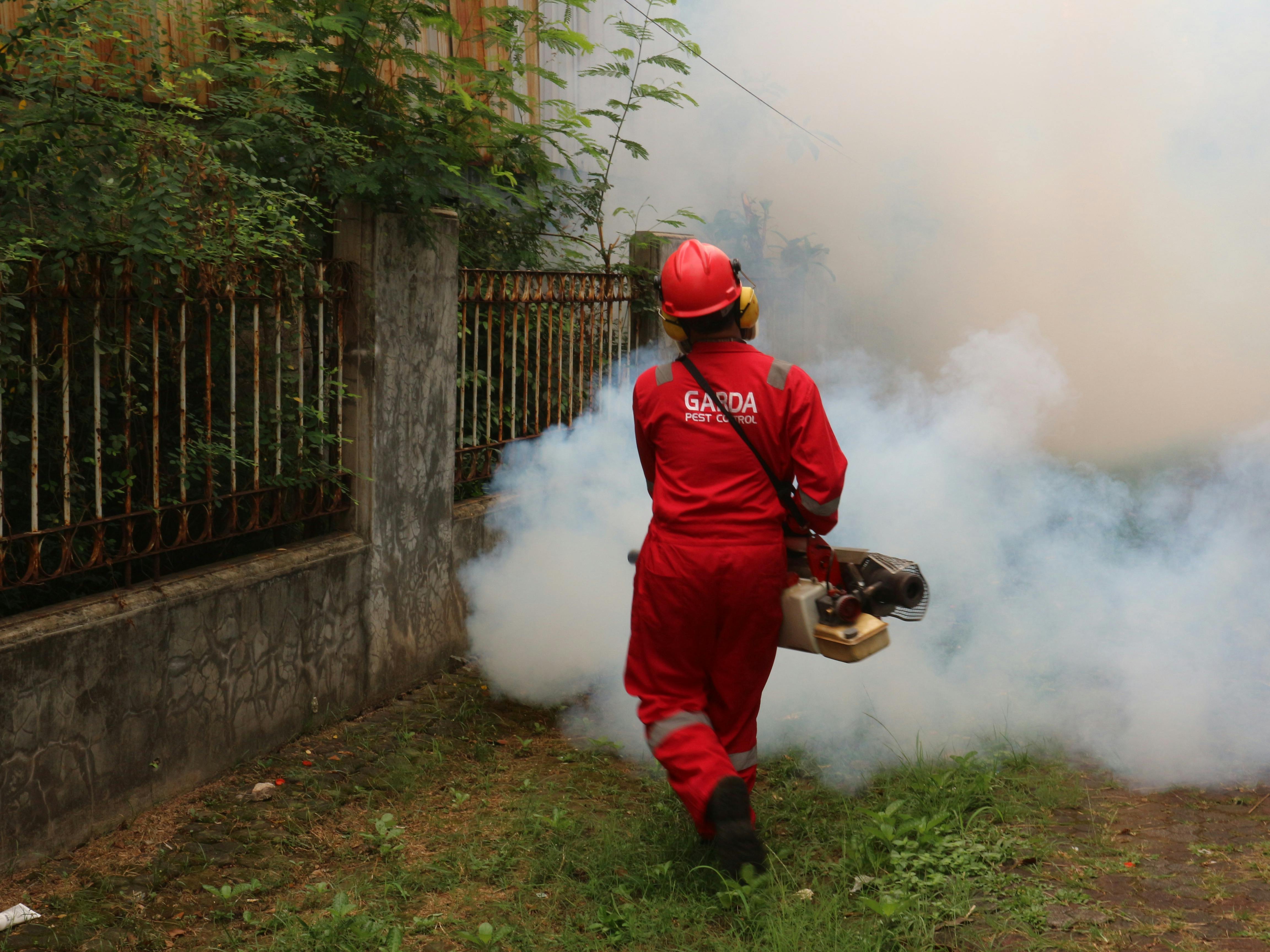 For informational purposes, demonstrates the appliance of pesticides over a lawn.